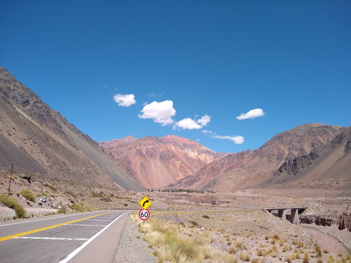 A road winding through the high Andes above the Mendoza River