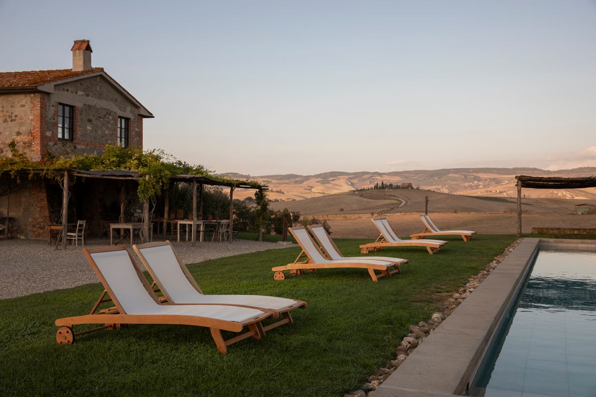 A vineyard lodge among gardens at golden hour