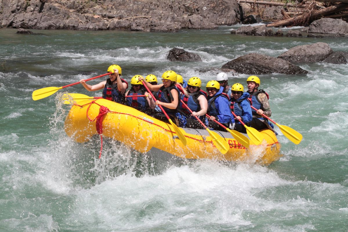 A rafting crew running whitewater on a mountain river